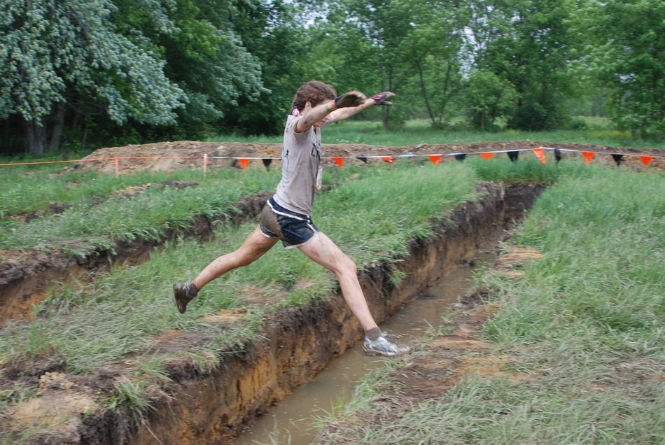 jumping girl over the grass