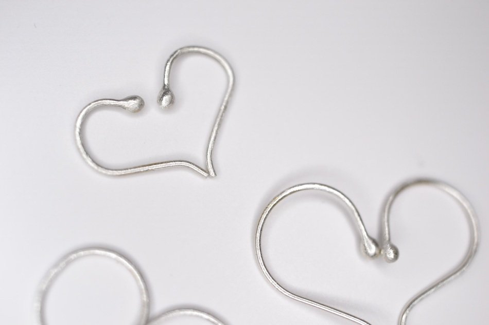 silver hearts on a white background