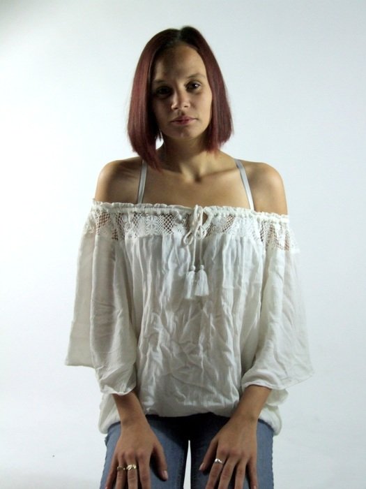 portrait of a girl in a white blouse in the studio