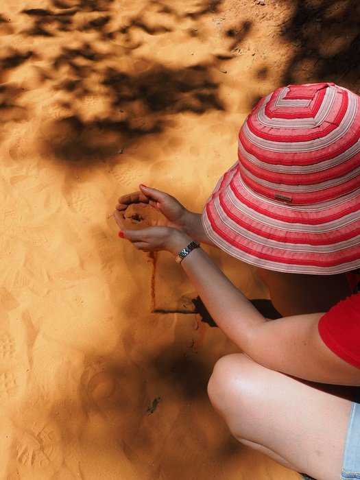 woman playing with sand
