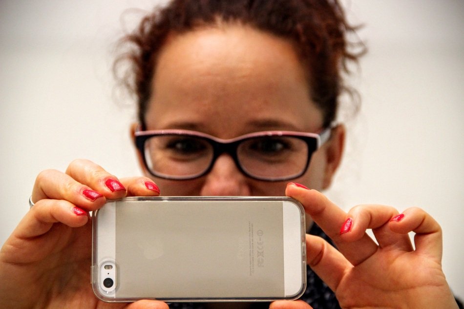 Woman is recording with Iphone