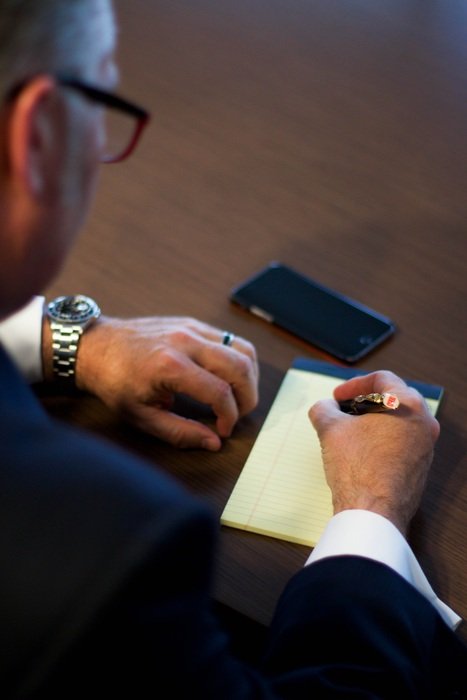 businessman writes down strategies