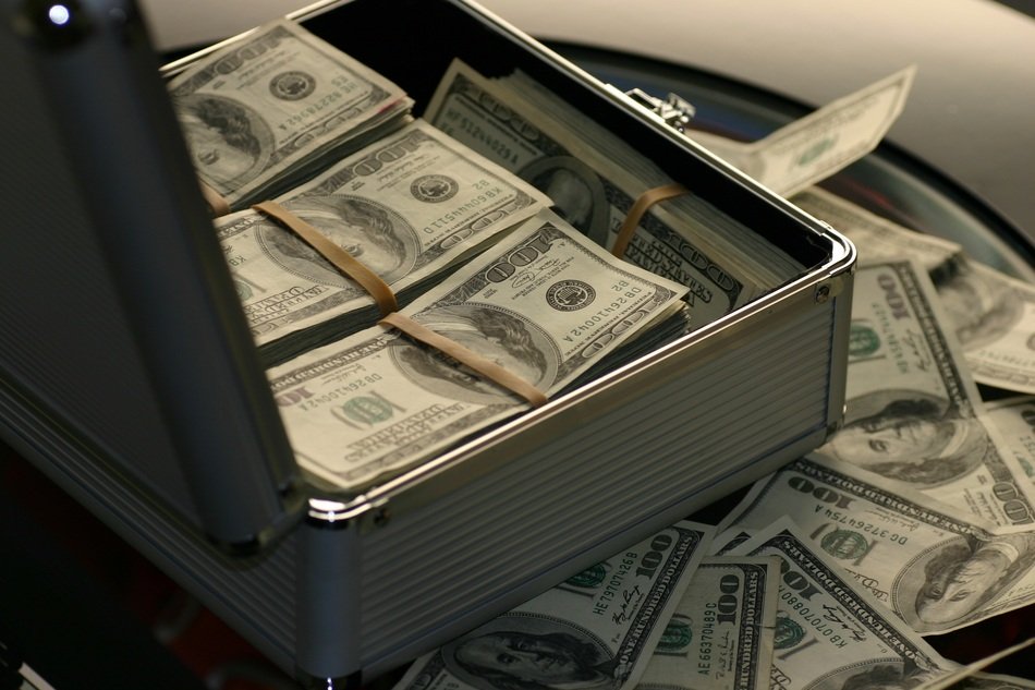 suitcase with dollars