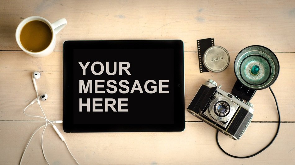 your message here, coffee and camera on the table, background with copyspace