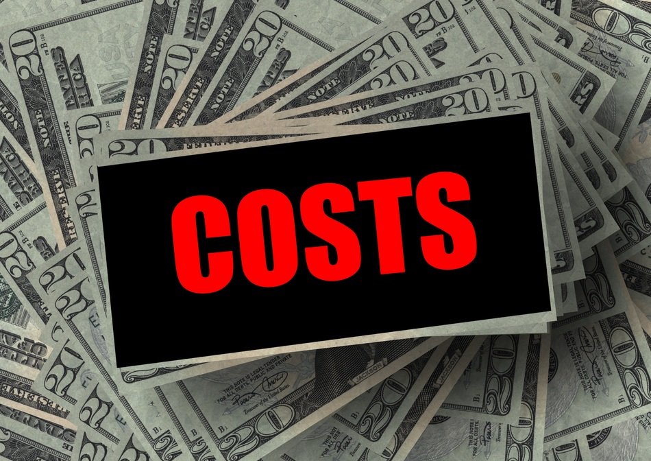 black sign with the red word on the background of dollar bills