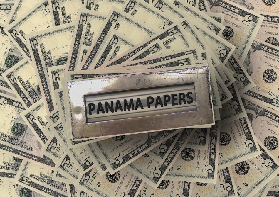 metal box on dollar bills
