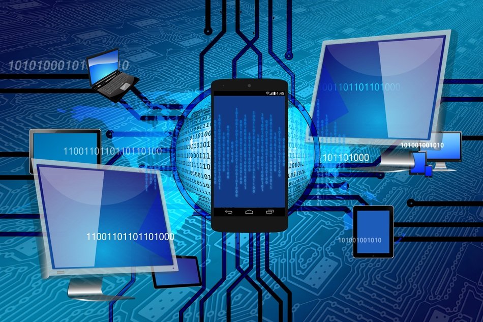 computer and smartphone on the background of binary code