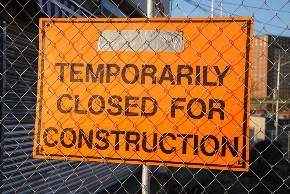 temporary closed for construction, board with inscription on construction site
