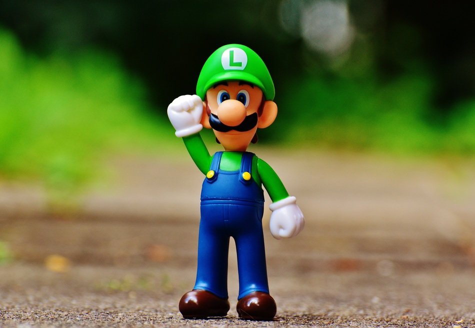 super mario with hand raised in the park