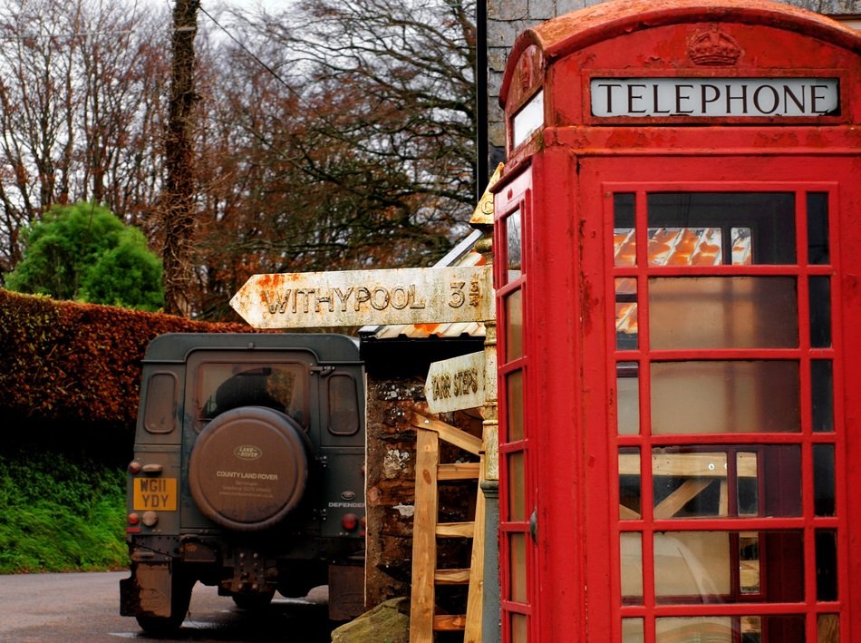 red telephone box in the countryside