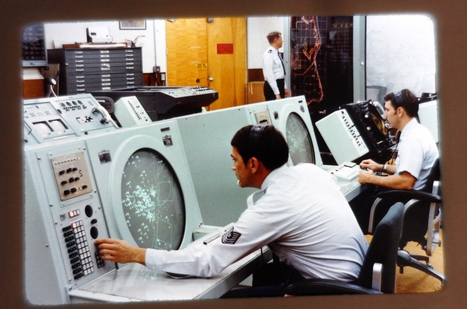 military people behind the screens satellite communications
