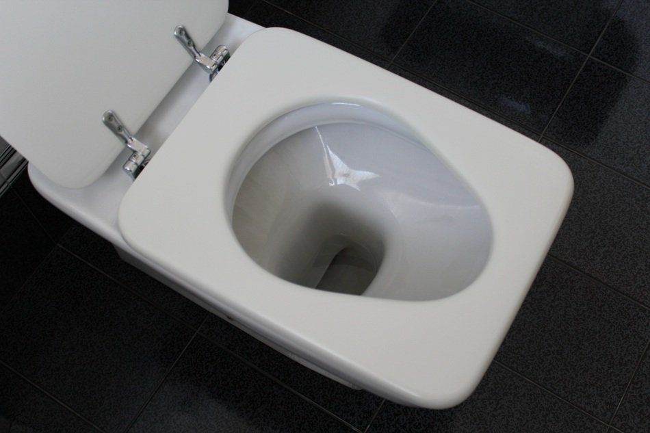 White toilet on black