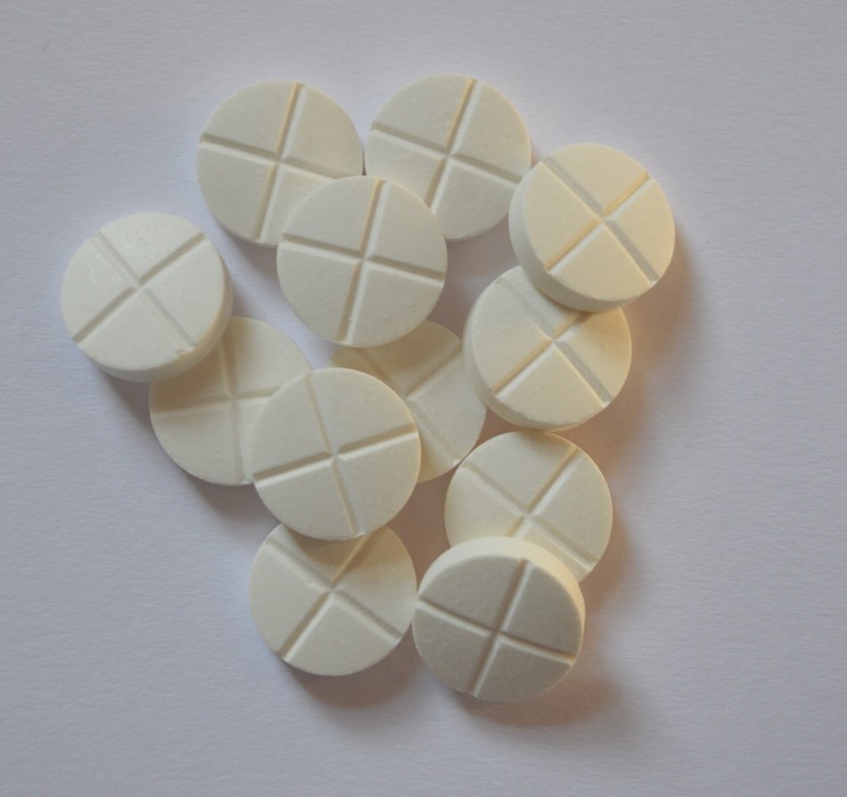 White round drugs with the cross on them