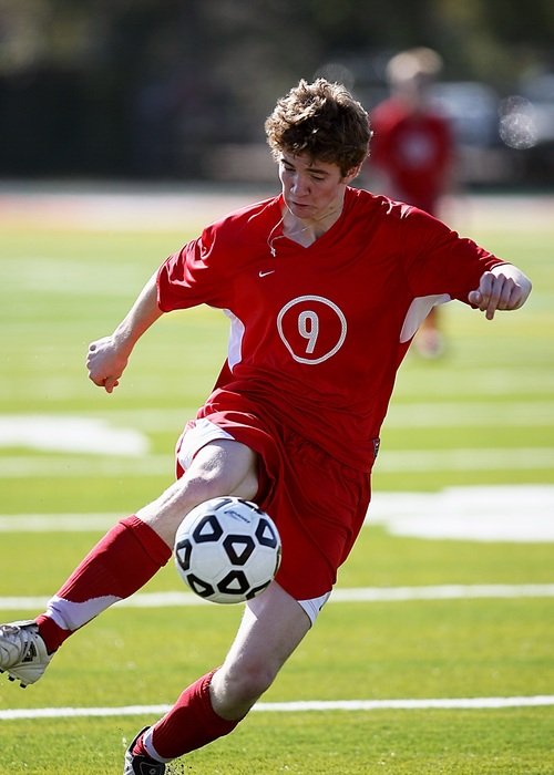soccer player in the red form