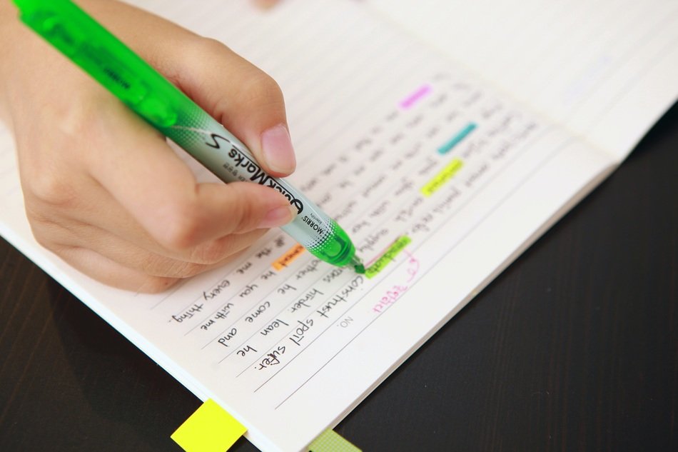person Coloring text with Fluorescent pen