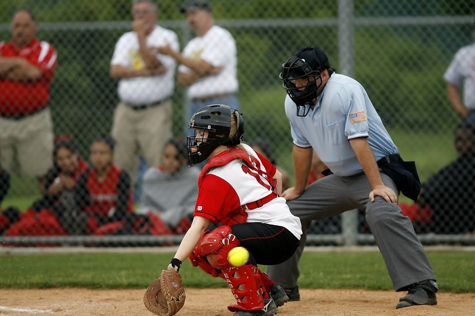 Softball player and umpire