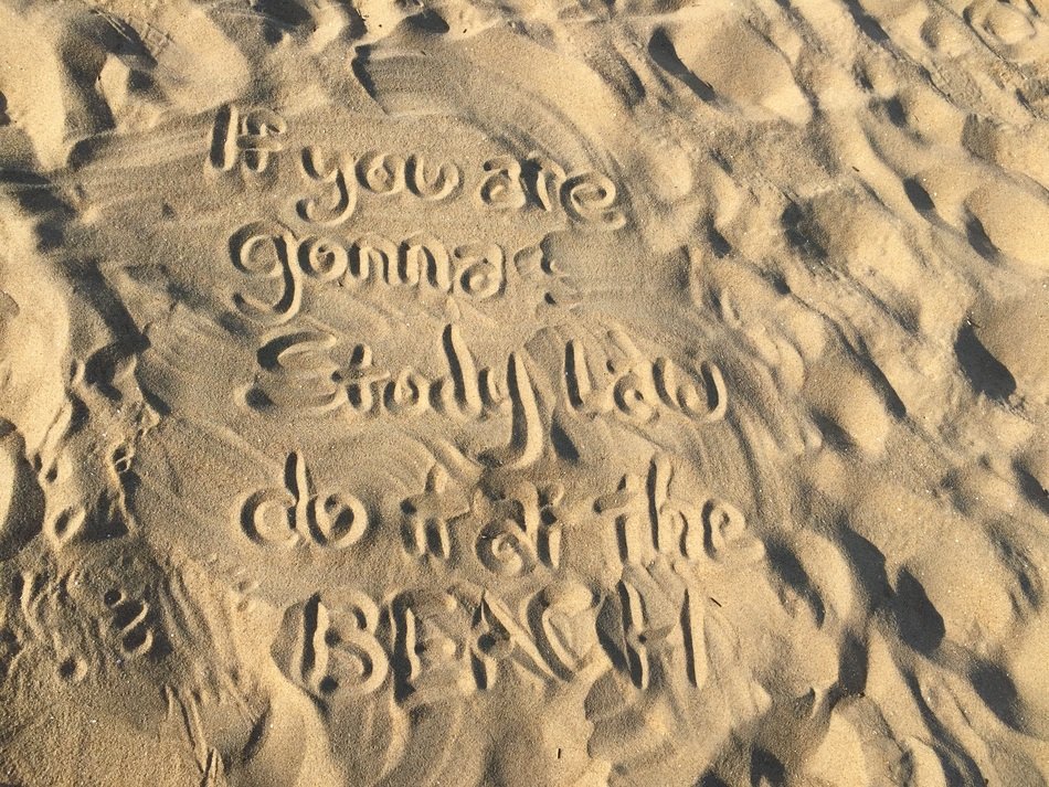 spelling words in the sand on the beach