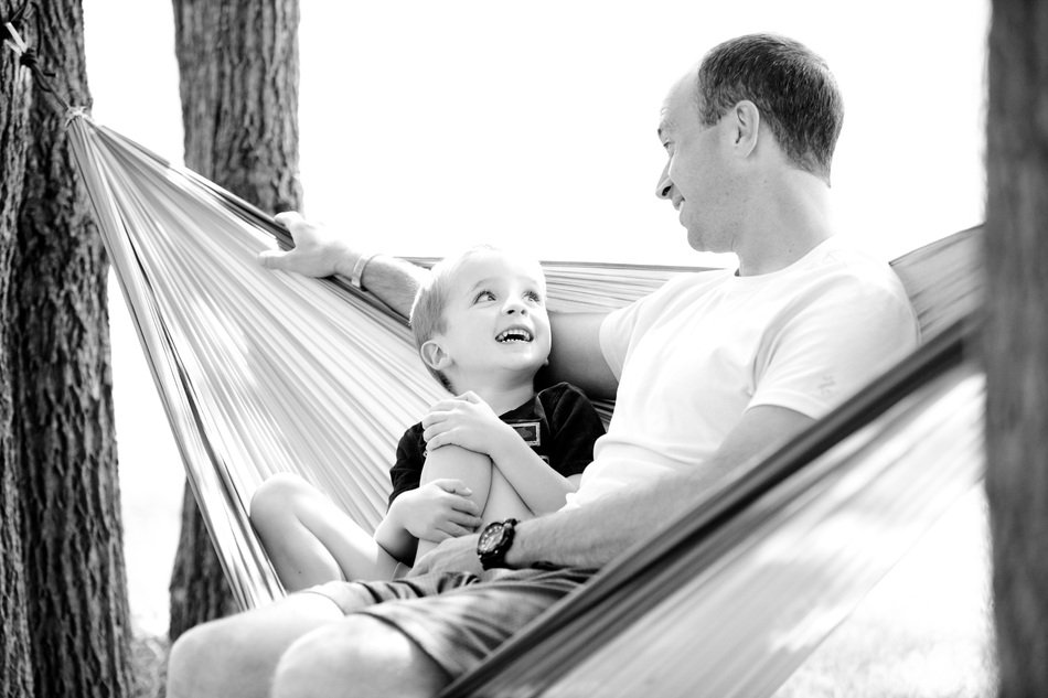 happy father with baby in a hammock