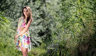 girl in a bright dress on a summer day