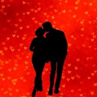 black silhouette of kissing couple on the red background