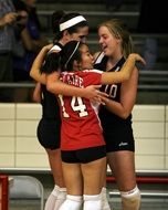 Group of girls in volleyball team celebrate