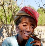 Portrait of happy smoking woman