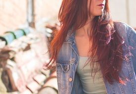 girl with red hair in the rays of light