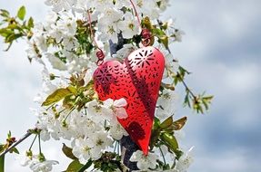 heart figurine on white flowers