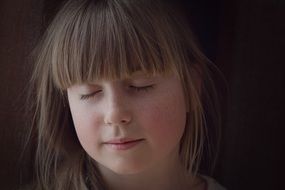 portrait of a girl with closed eyes