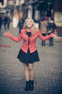 beautiful smiling girl among the city street