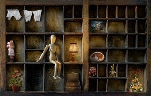Wood doll on a drawer