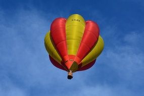 red yellow hot air balloon in the sky