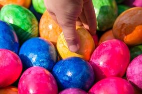 hand on the Easter eggs