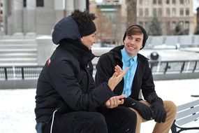 friends on a bench on a winter day