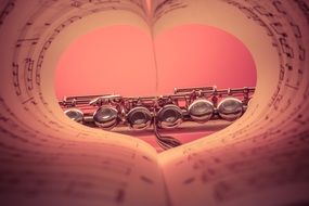 heart of notes on flute background