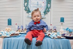 baby on the table for the celebration of the first birthday