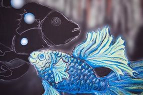 painted fish on the stained glass window