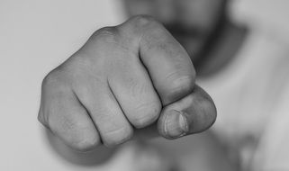 Black and white photo of close-up of the male fist