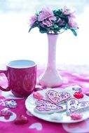 Valentine's Day cookies and flowers on the table