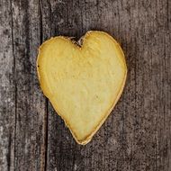 ginger heart on wooden surface