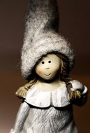 cute ceramic doll in a hat