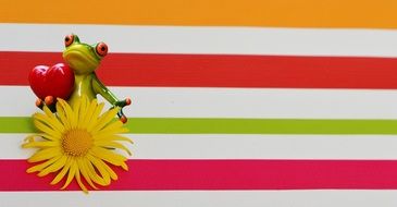 ceramic frog and yellow flower