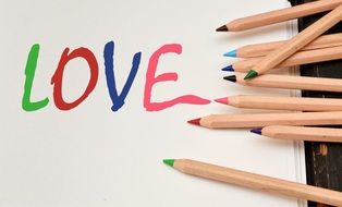 inscription "love" made with colored pencils