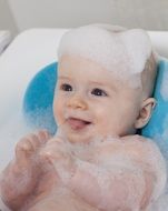 picture of the cheerful child in a bath