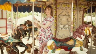 Girl On small Carousel