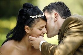 kissing bride and groom