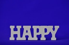 inscription Happy on the blue background