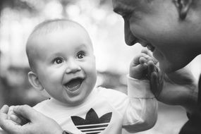 happy little baby with dad