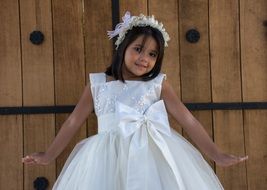 happy little girl in white dress