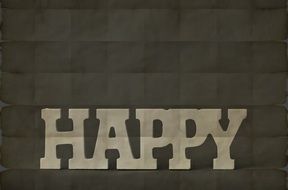inscription Happy on the grey background